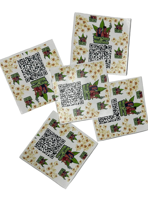 Five square stickers with QR codes and decorative designs on a metallic surface